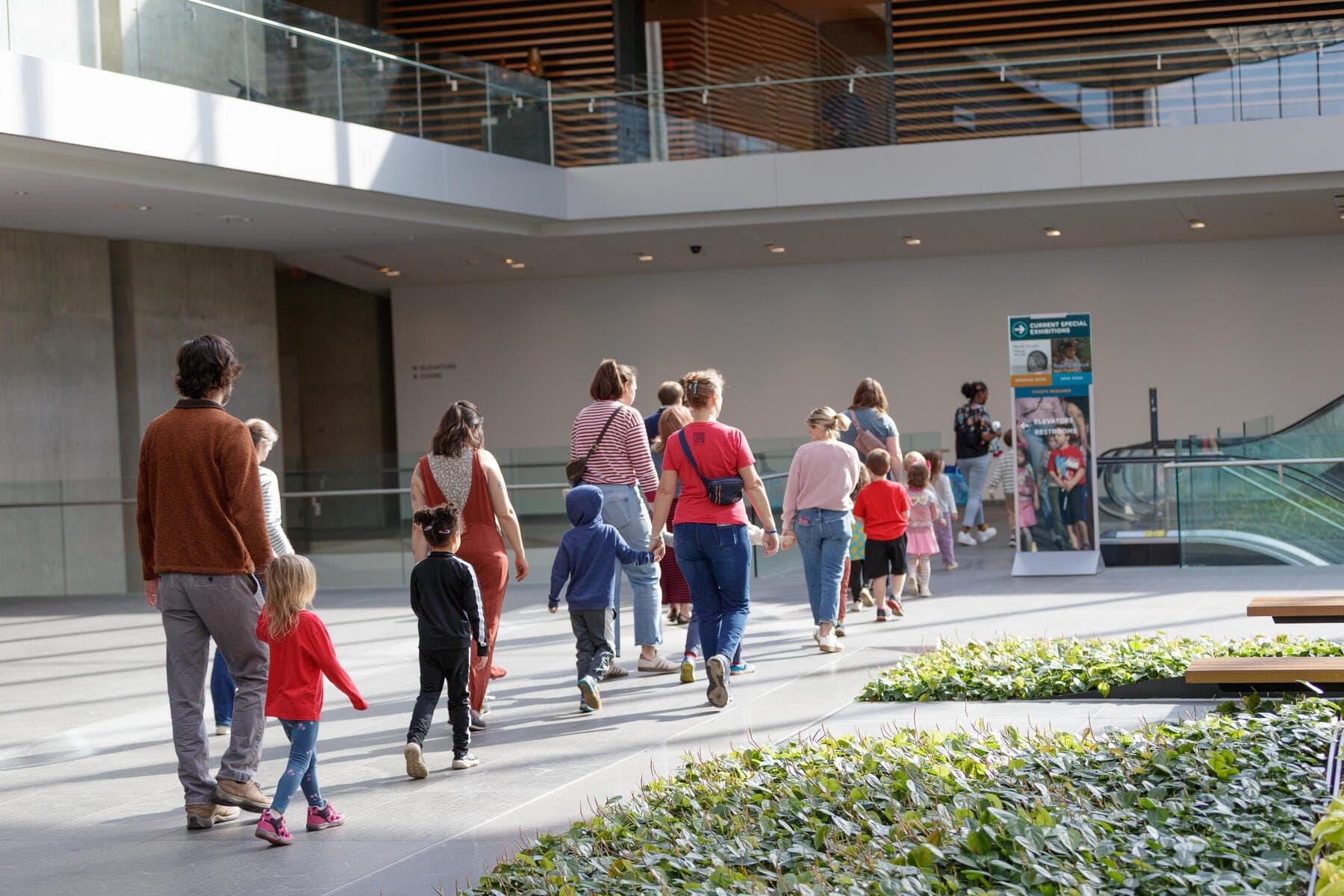 a group of people walking outside a building