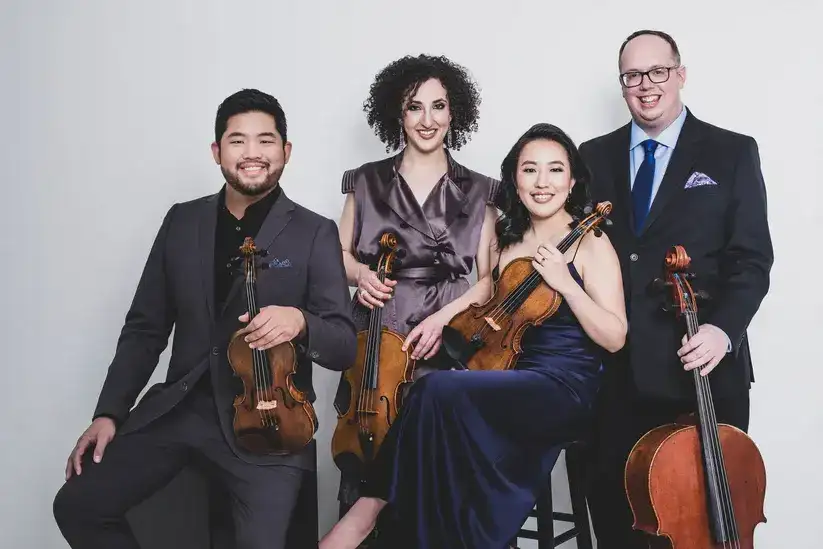 Sanaya Irani et al. holding musical instruments