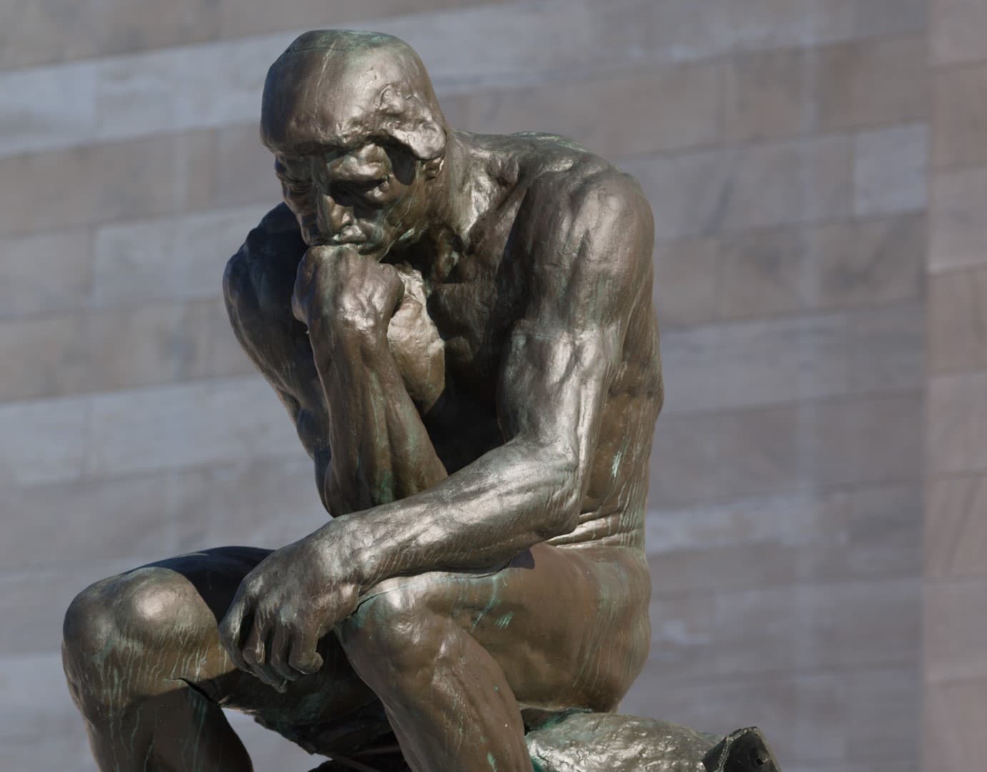 Bronze sculpture by Rodin titled "The Thinker"