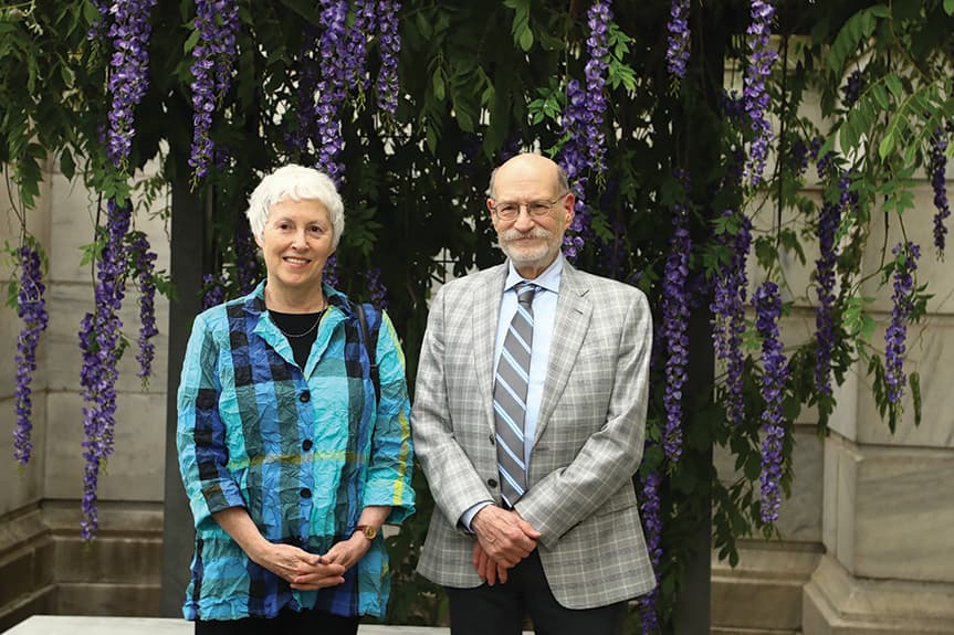 couple in front of purple flowers