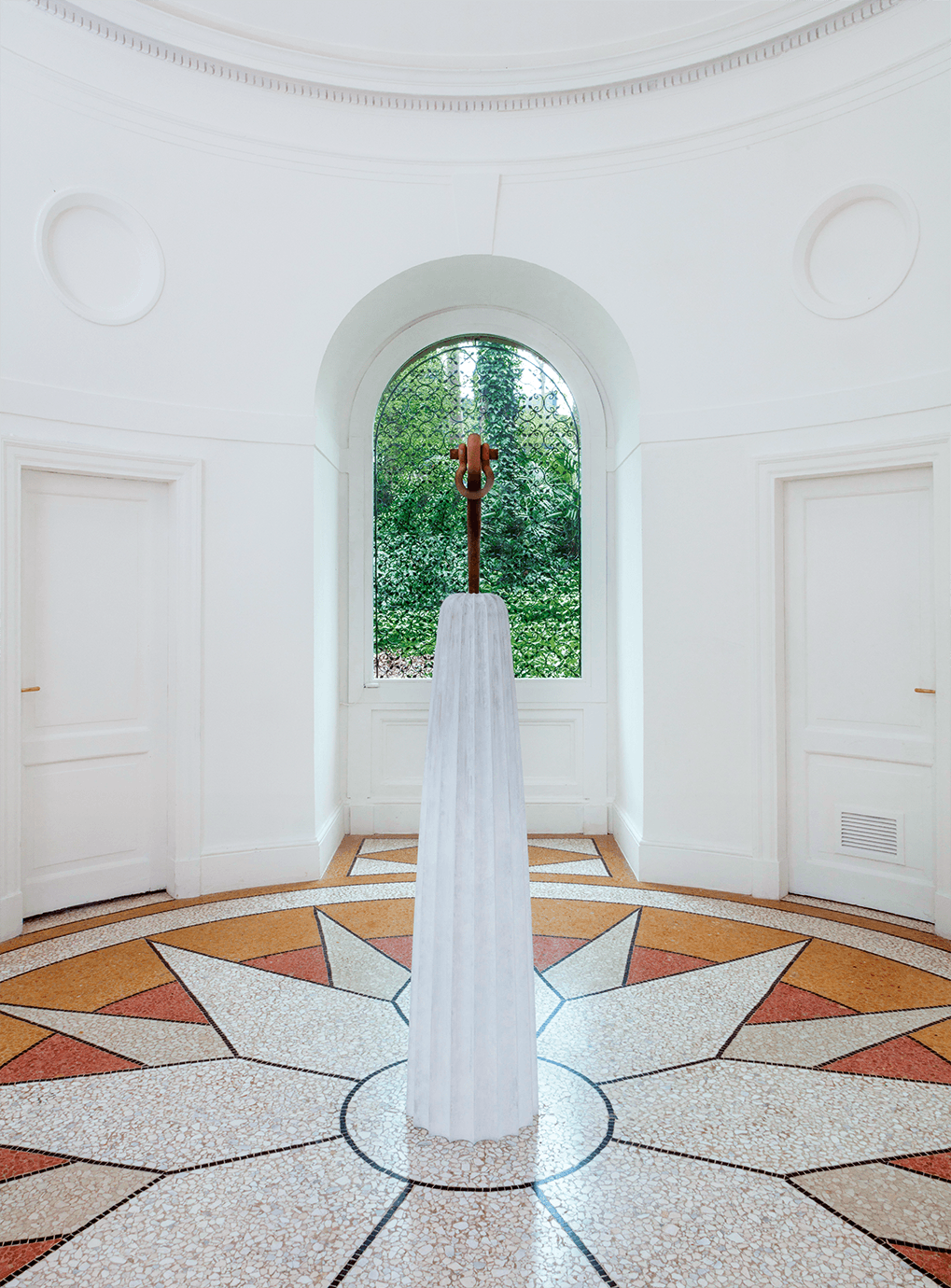 white statue in middle of room