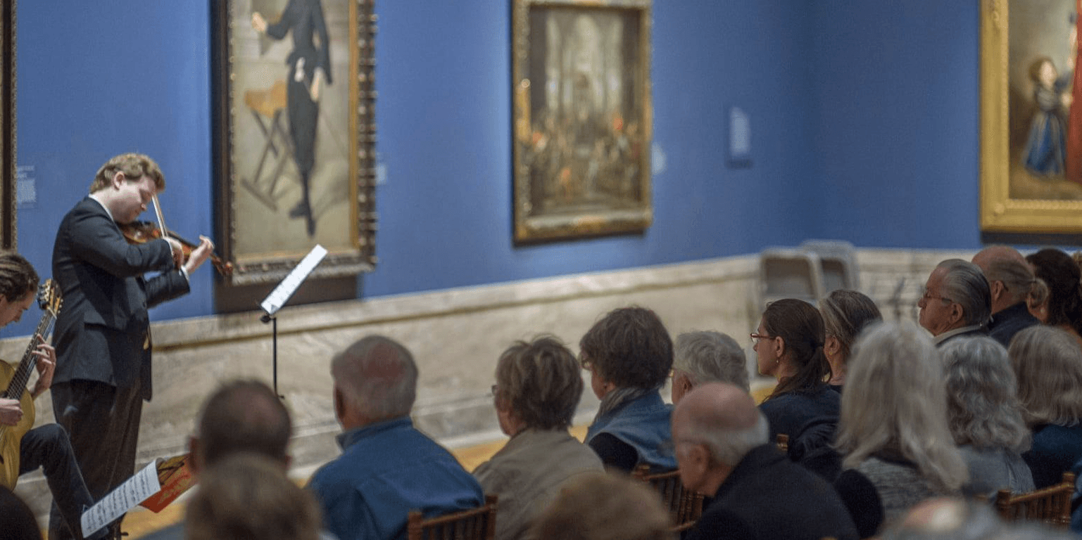 Violinist playing chamber music in the gallery