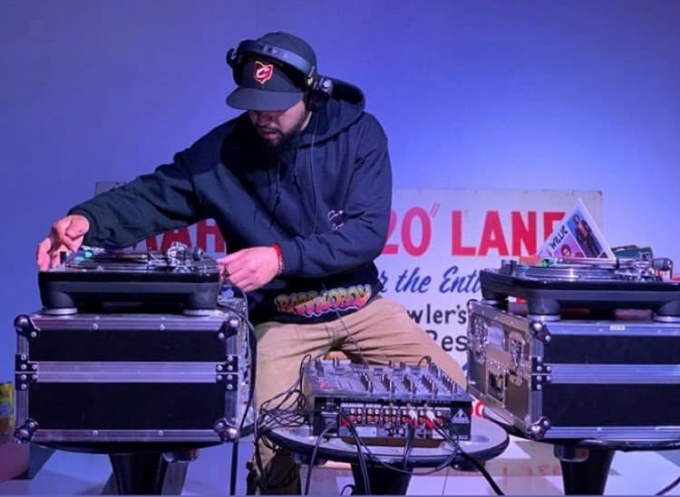 Image of a DJ playing a record