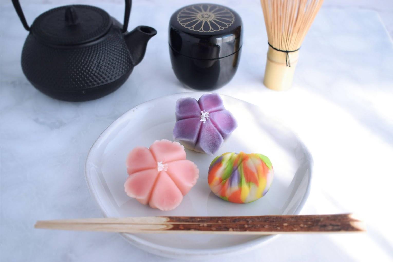 Image of Japanese floral edible treats and tea pot and accessories