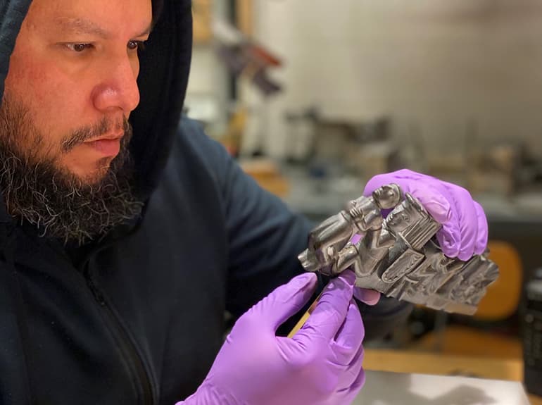 mount maker holding an object