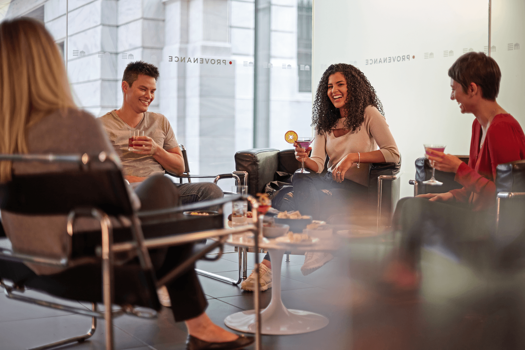 a group of people sitting around a table