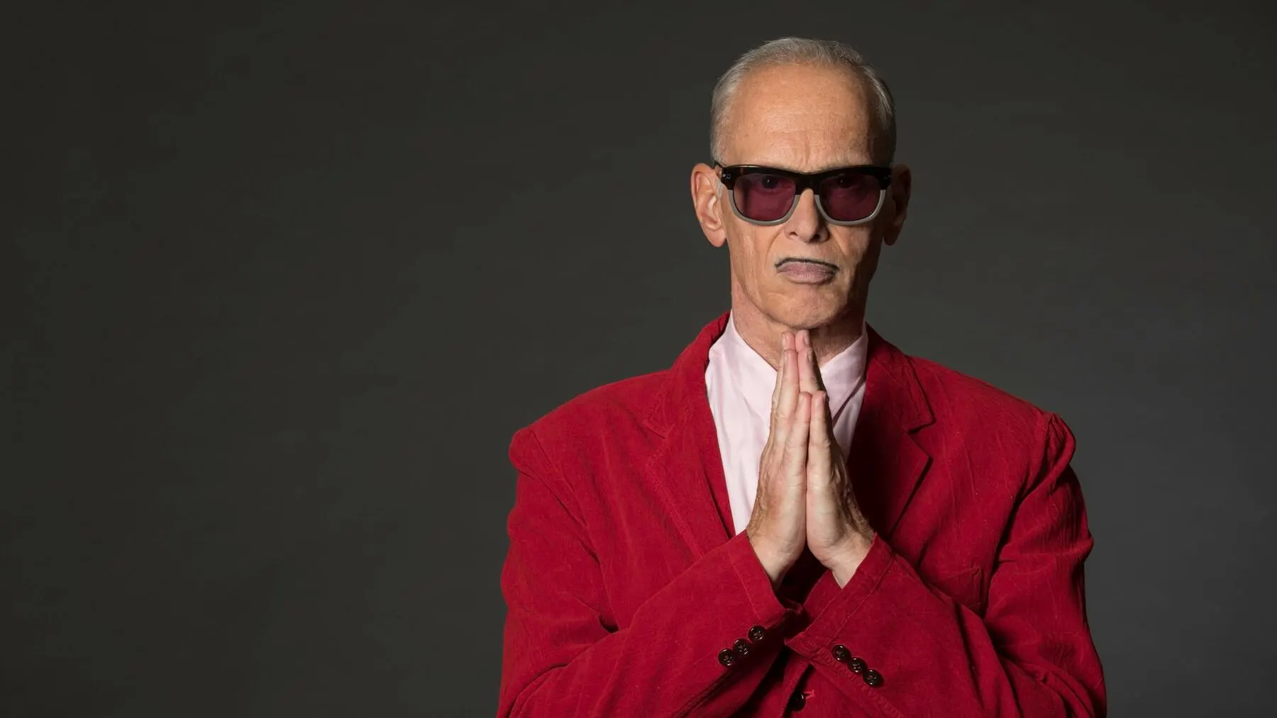 John Waters wearing sunglasses