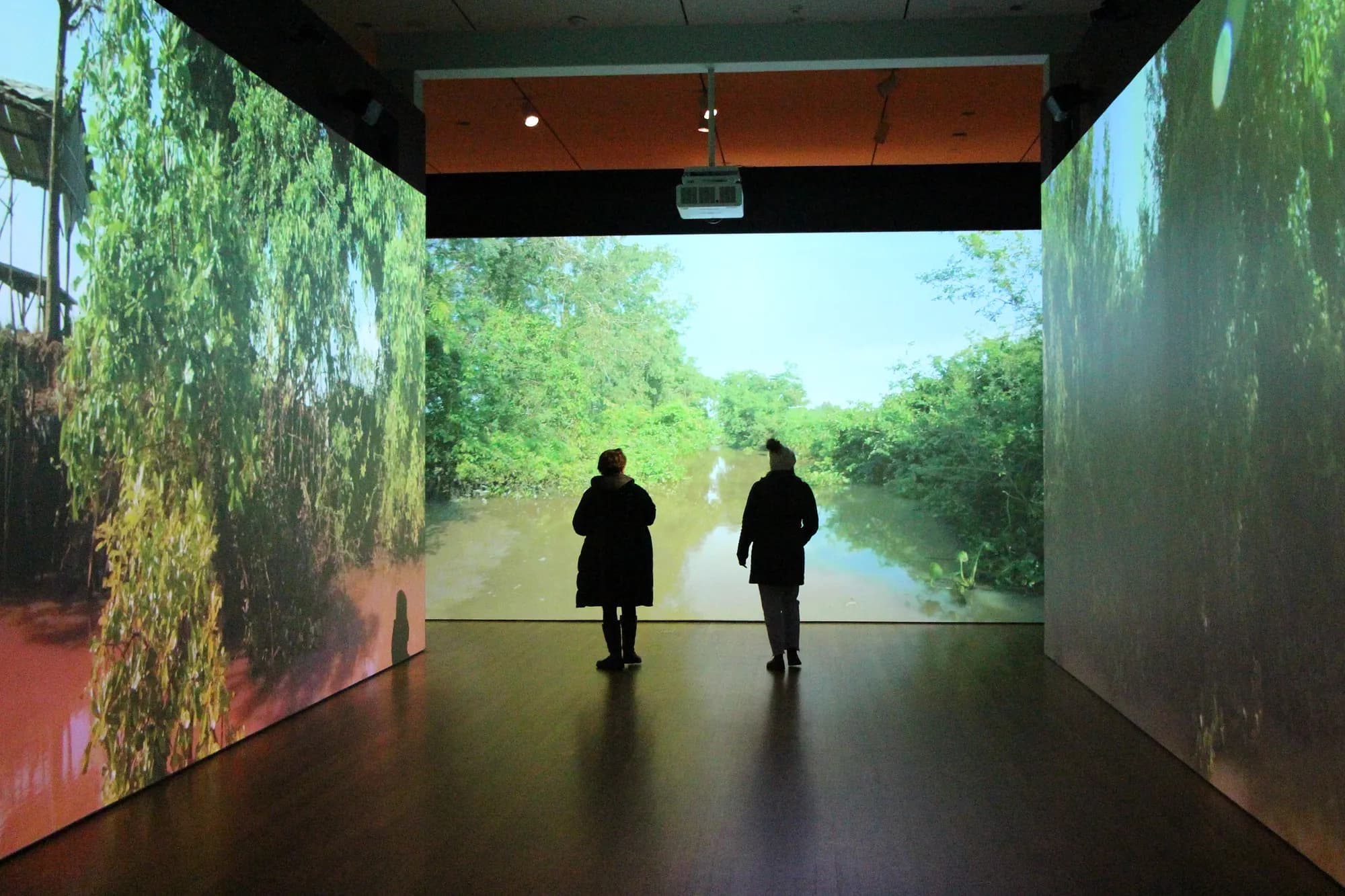 visitors exploring the interactive screens from the revealing krishna exhibit